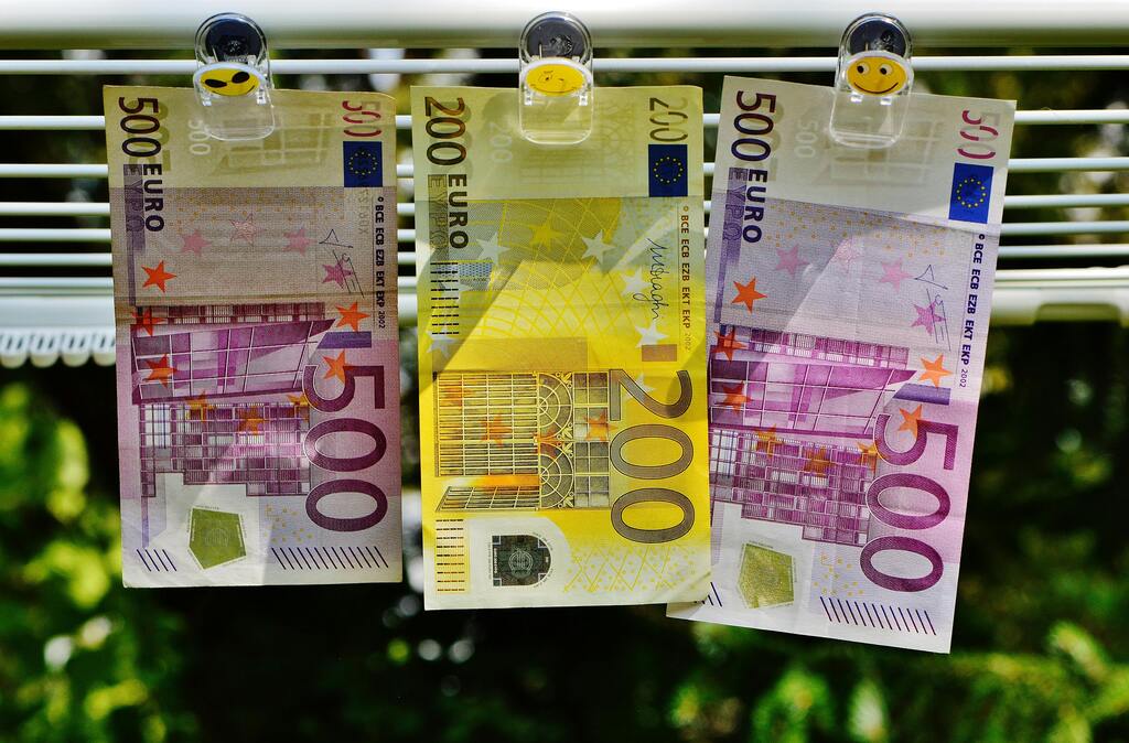 Euro currency notes clipped to a line
